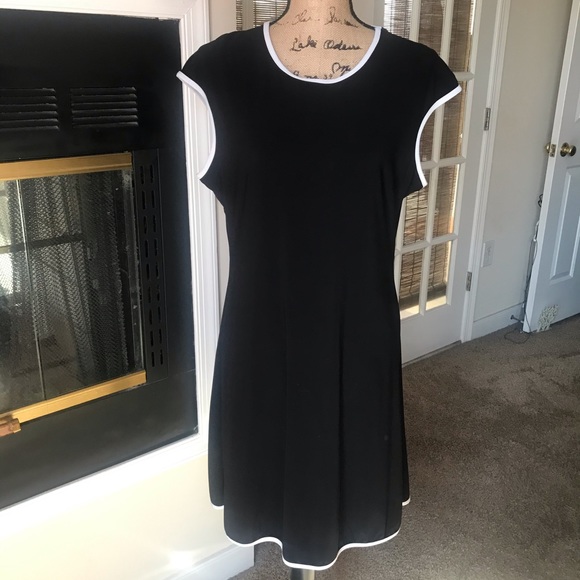 Dresses & Skirts - Black with white trim. Necklace sold separately.